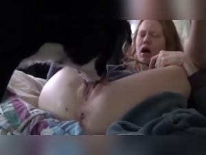 Bestial sex video with a red-haired woman and her dog
