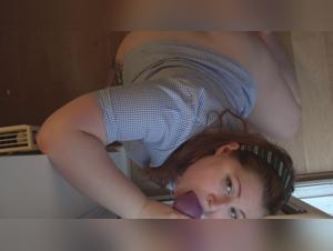 Watch this woman perform oral sex with a dildo in doggy position in this bestiality sex video