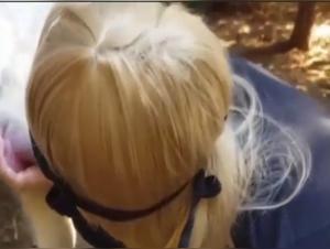 Sex video with dog: a woman pleasures herself outdoors