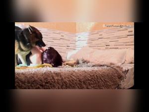 Free Bestiality: Woman and dog in a passionate kiss