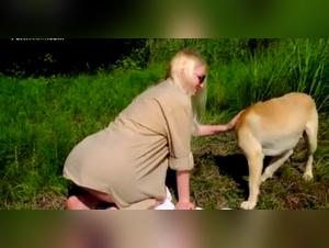 Married Woman and Dog in the Forest